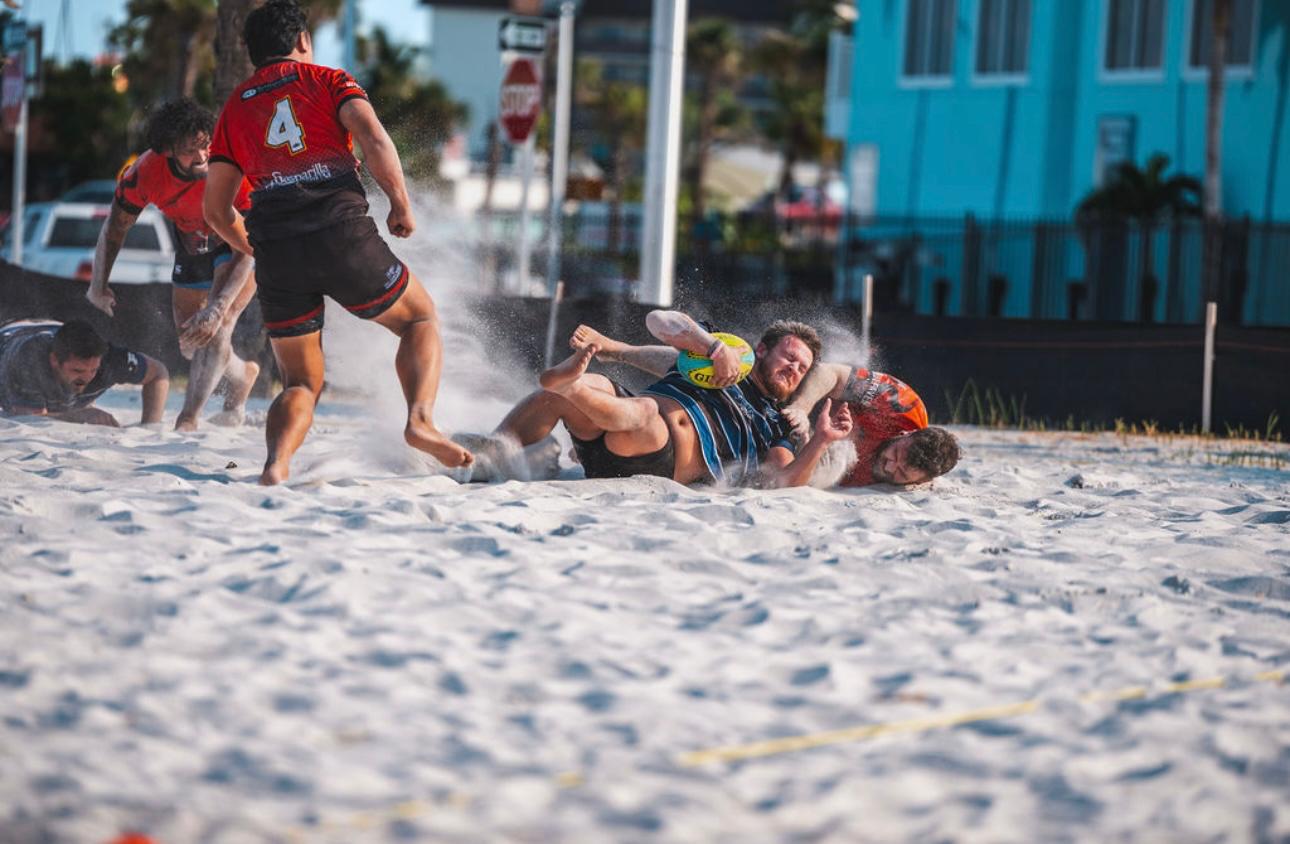 Beach rugby offload